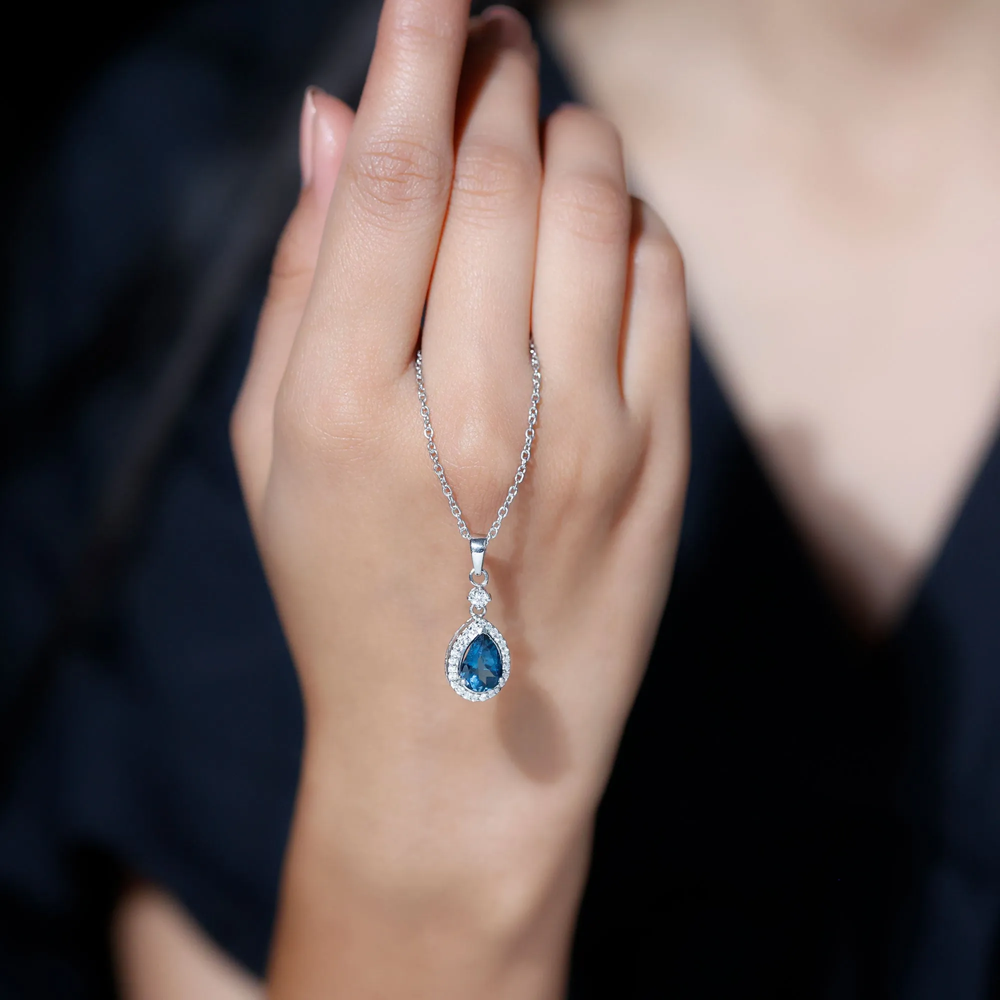 4.25 CT London Blue Topaz and Moissanite Halo Pendant Necklace in Silver