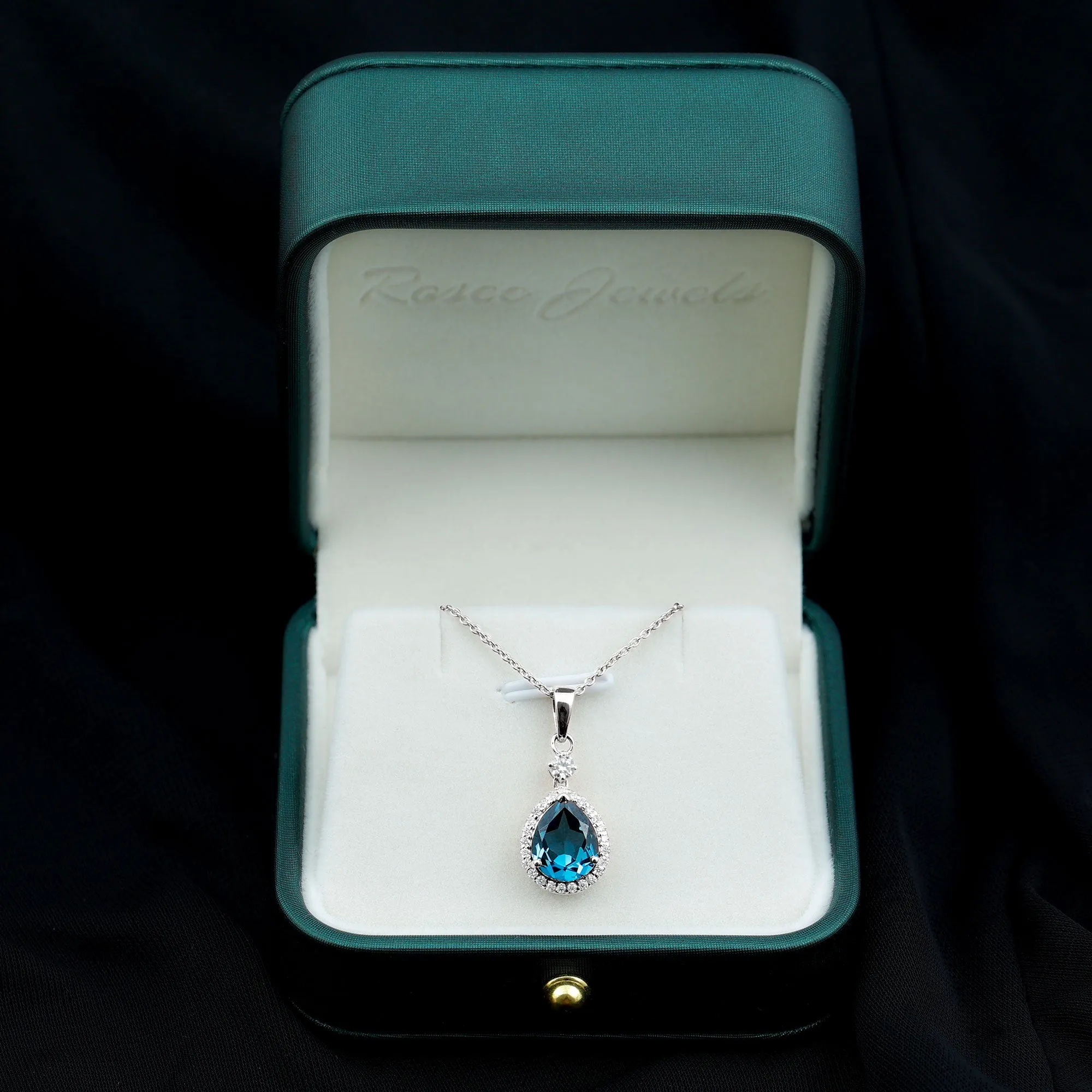 4.25 CT London Blue Topaz and Moissanite Halo Pendant Necklace in Silver