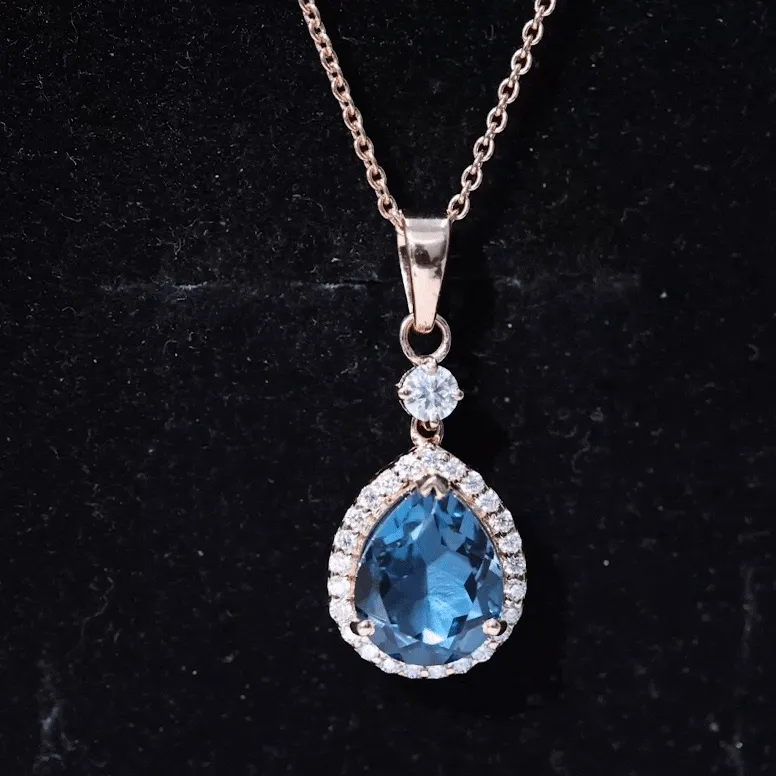 4.25 CT London Blue Topaz and Moissanite Halo Pendant Necklace in Silver