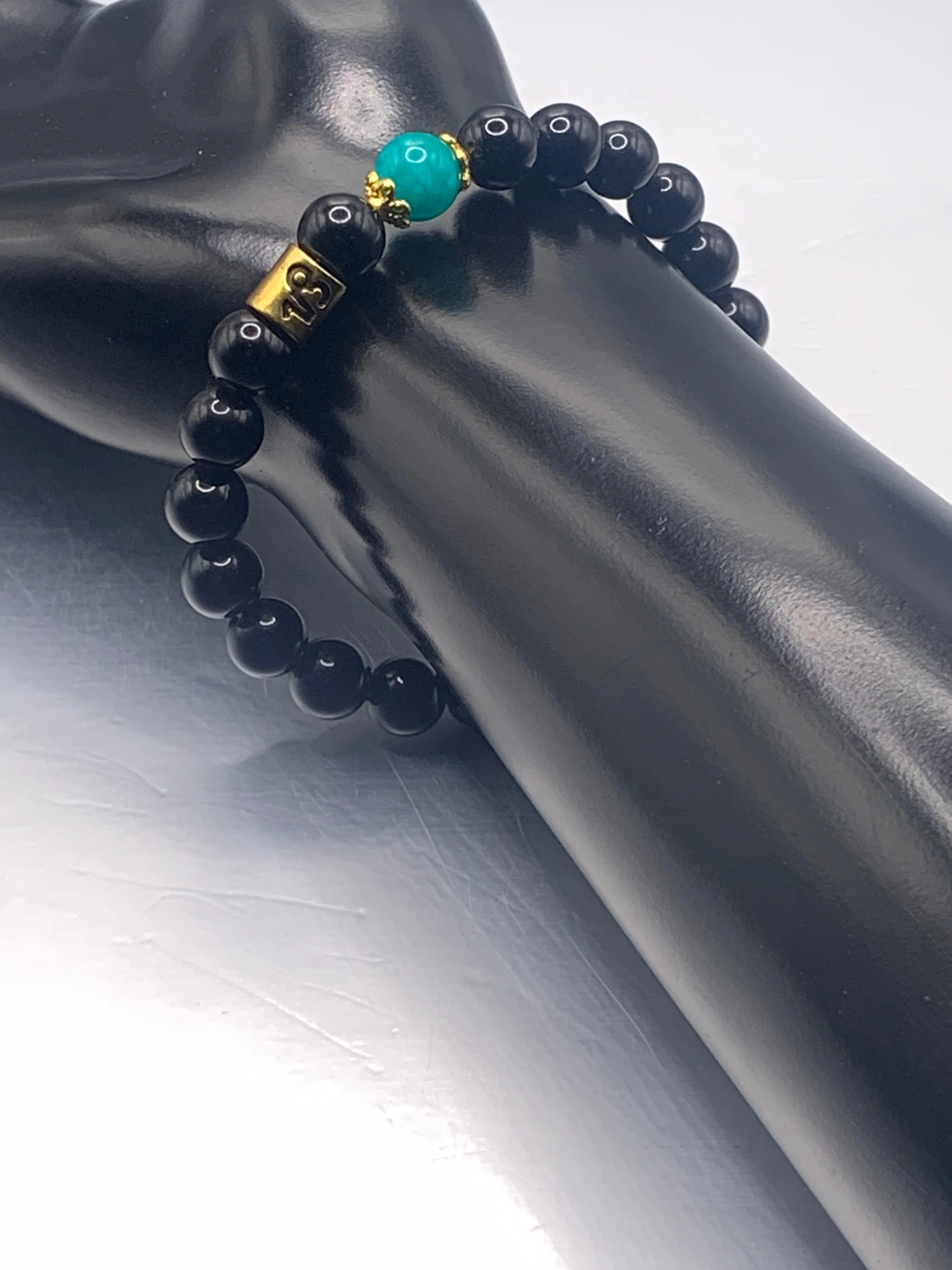 Capricorn Zodiac black obsidian with aquamarine chalcedony elastic beaded bracelet with gold accents