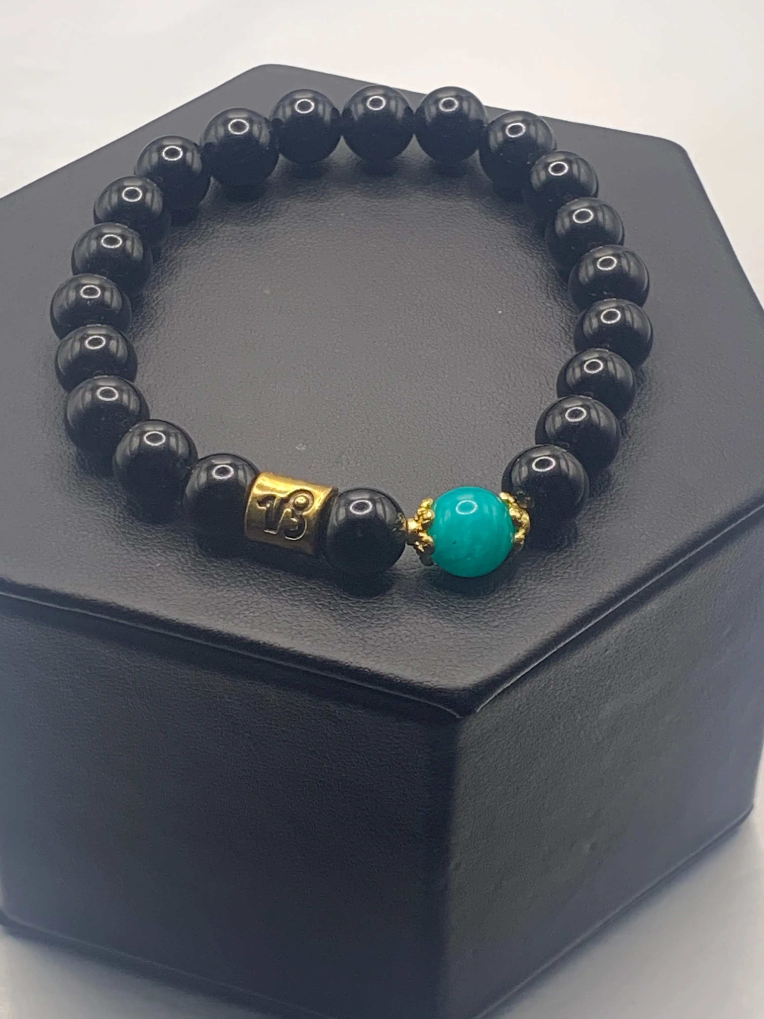 Capricorn Zodiac black obsidian with aquamarine chalcedony elastic beaded bracelet with gold accents