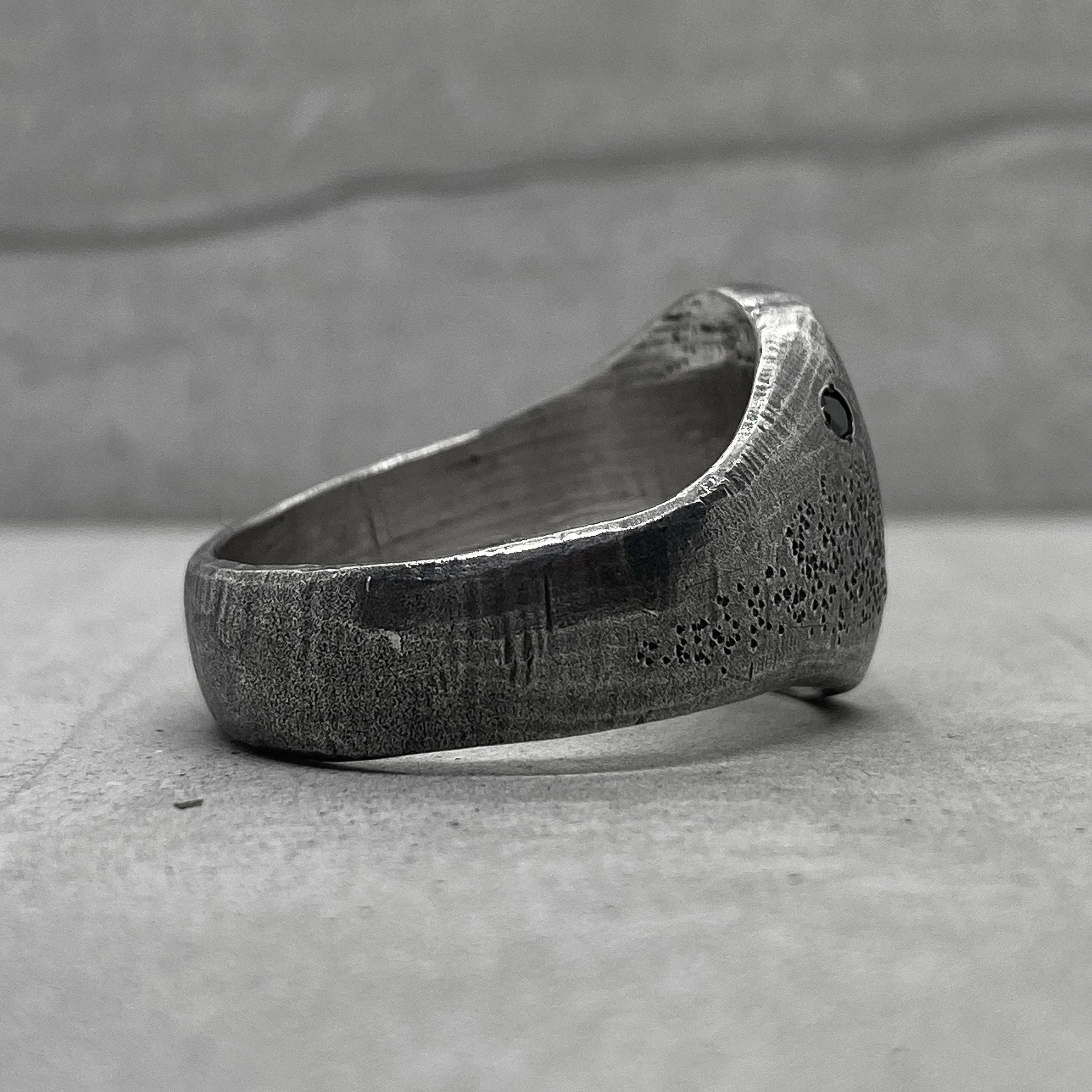 Space ring- textured oval signet ring with several black diamonds