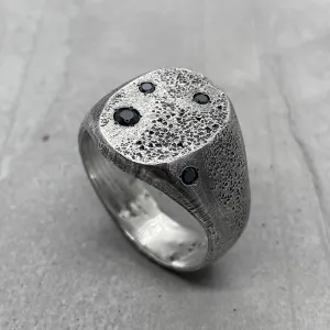 Space ring- textured oval signet ring with several black diamonds