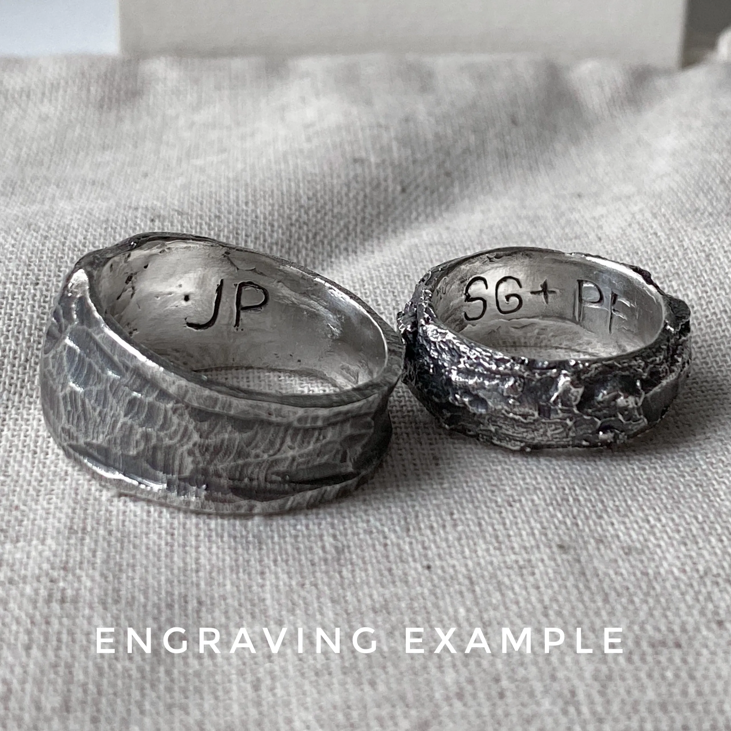 Space ring- textured oval signet ring with several black diamonds