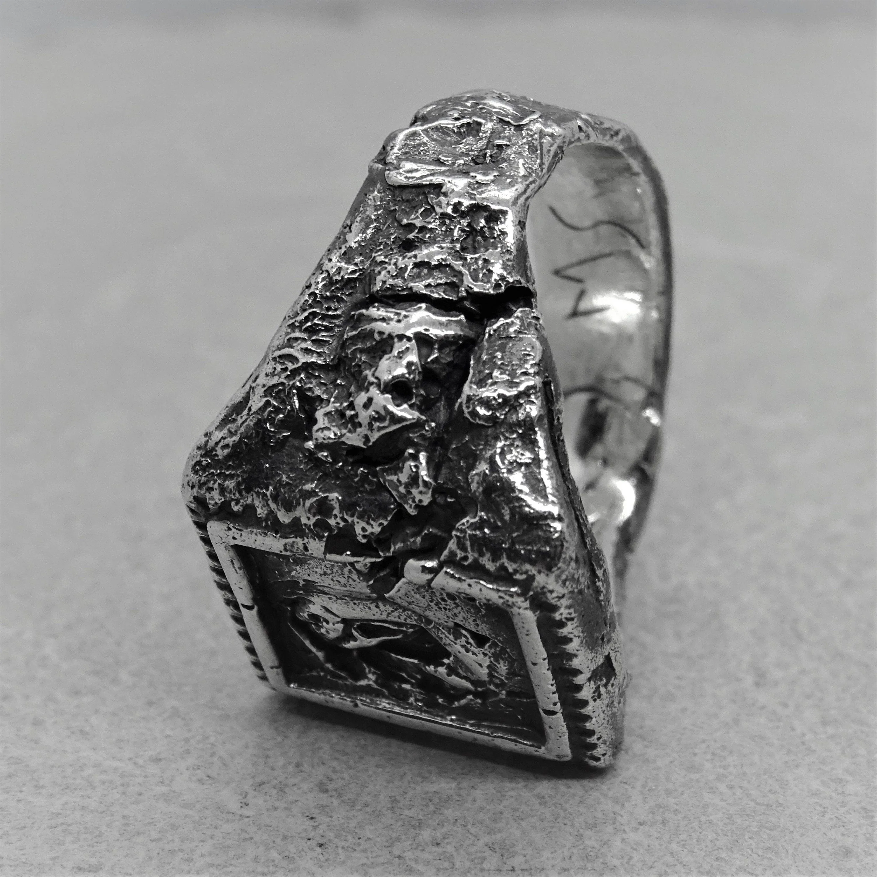 Svaneti ring - an unusual signet ring of a square shape with destroyed ethnic patterns