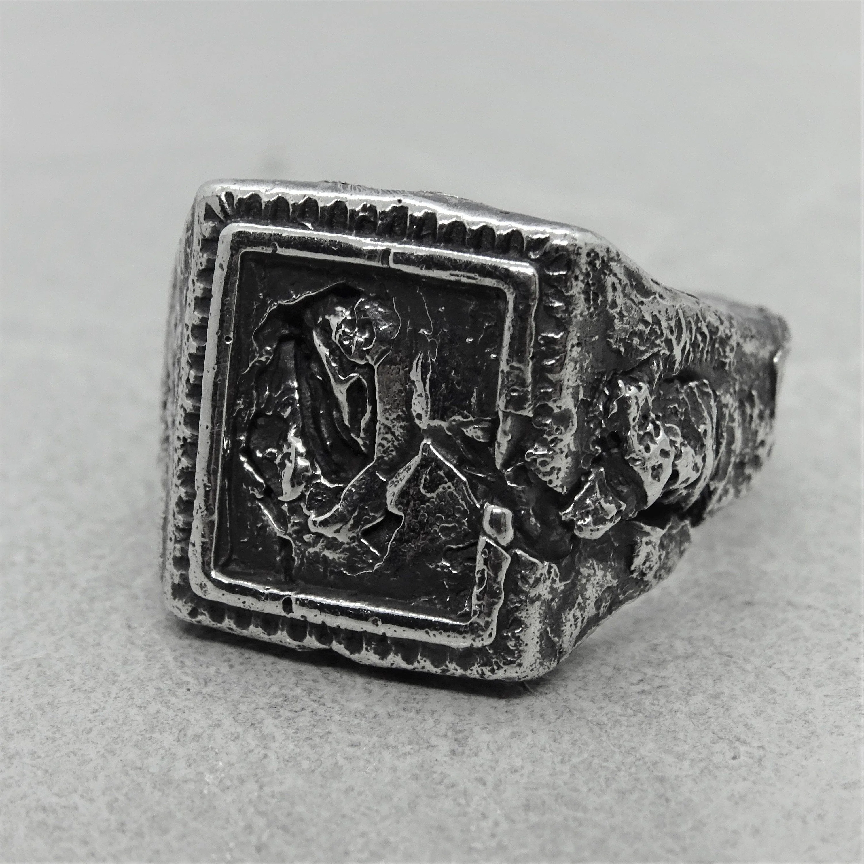 Svaneti ring - an unusual signet ring of a square shape with destroyed ethnic patterns